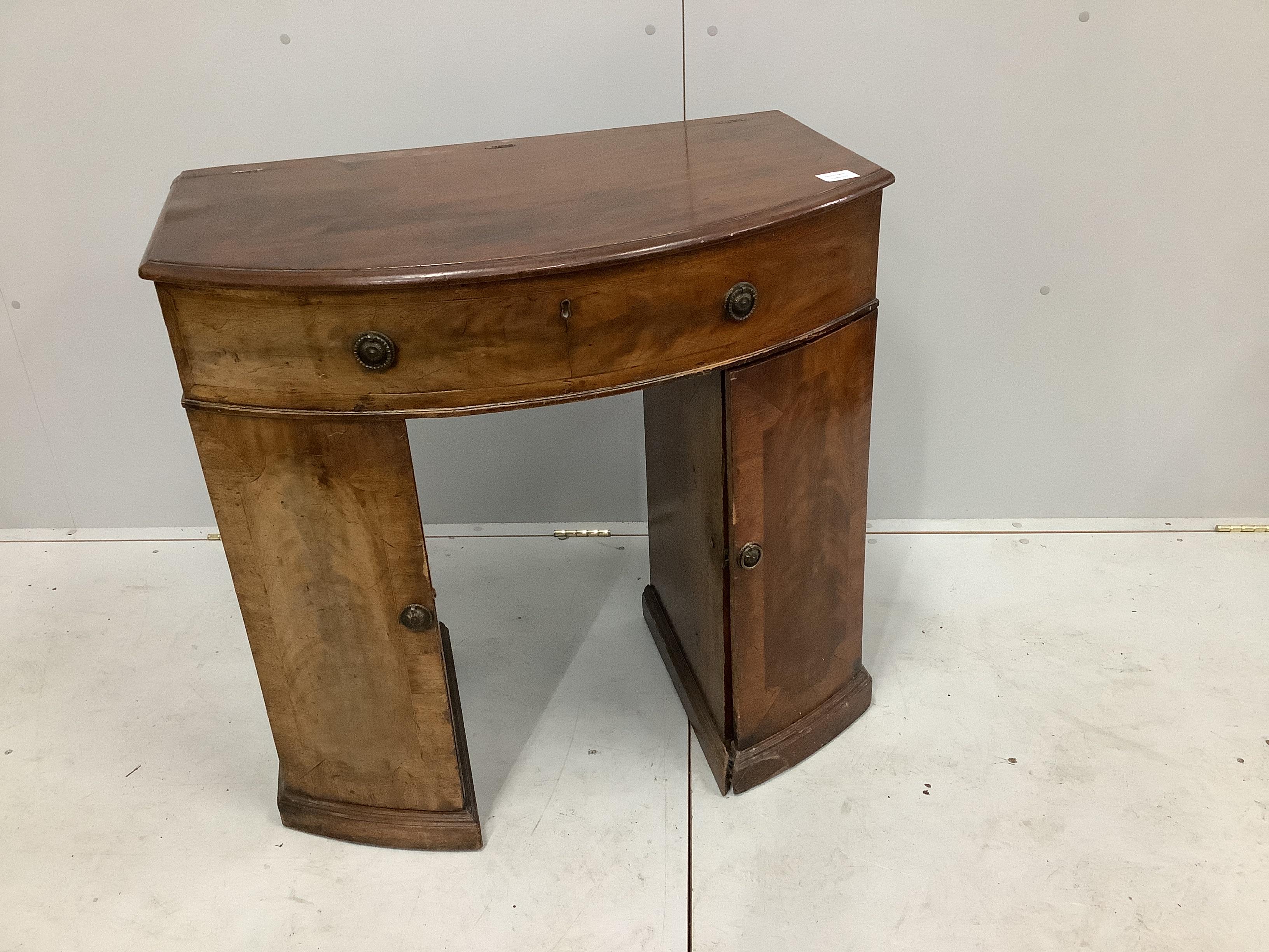 A 19th century and later bowfront enclosed dressing table, with hinged top, width 93cm, depth 49cm, height 80cm